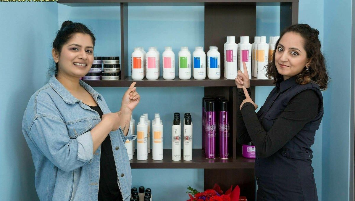 Two members of the Lahana team beside their professional hair products